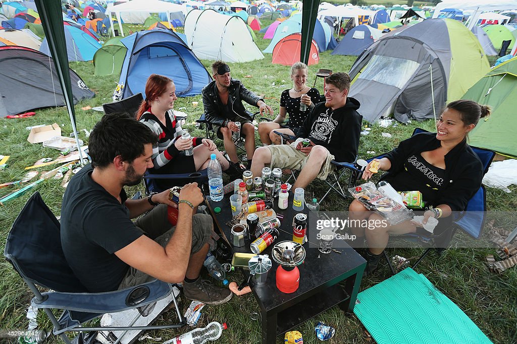 WACKEN, GERMANY - JULY 31:  Festival-goers relax at their camping spot at the 2014 Wacken Open Air heavy metal music festival on on July 31, 2014 in Wacken, Germany. Wacken is a village in northern Germany with a population of 1,800 that has hosted the annual four-day festival, which attracts 75,000 heavy metal fans from around the world, since 1990.  (Photo by Sean Gallup/Getty Images)